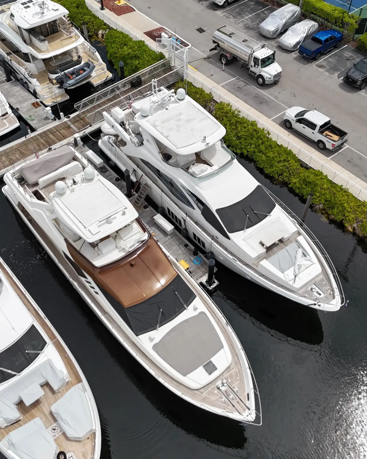 Exigo Fuels delivery truck serving luxury yacht at South Florida marina - Professional fuel delivery services